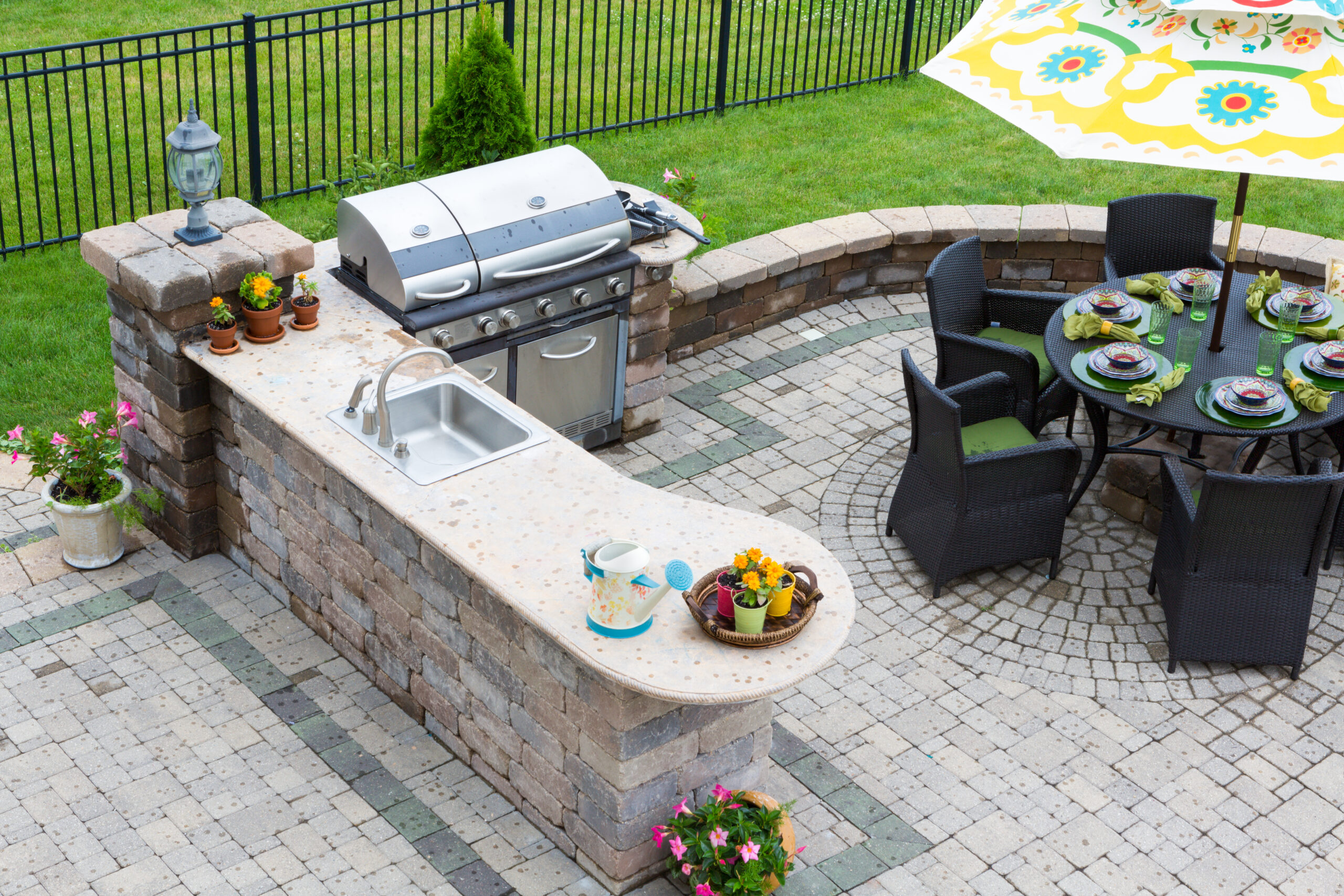 Custom paver patio with fire pit area installed in Natick, MA