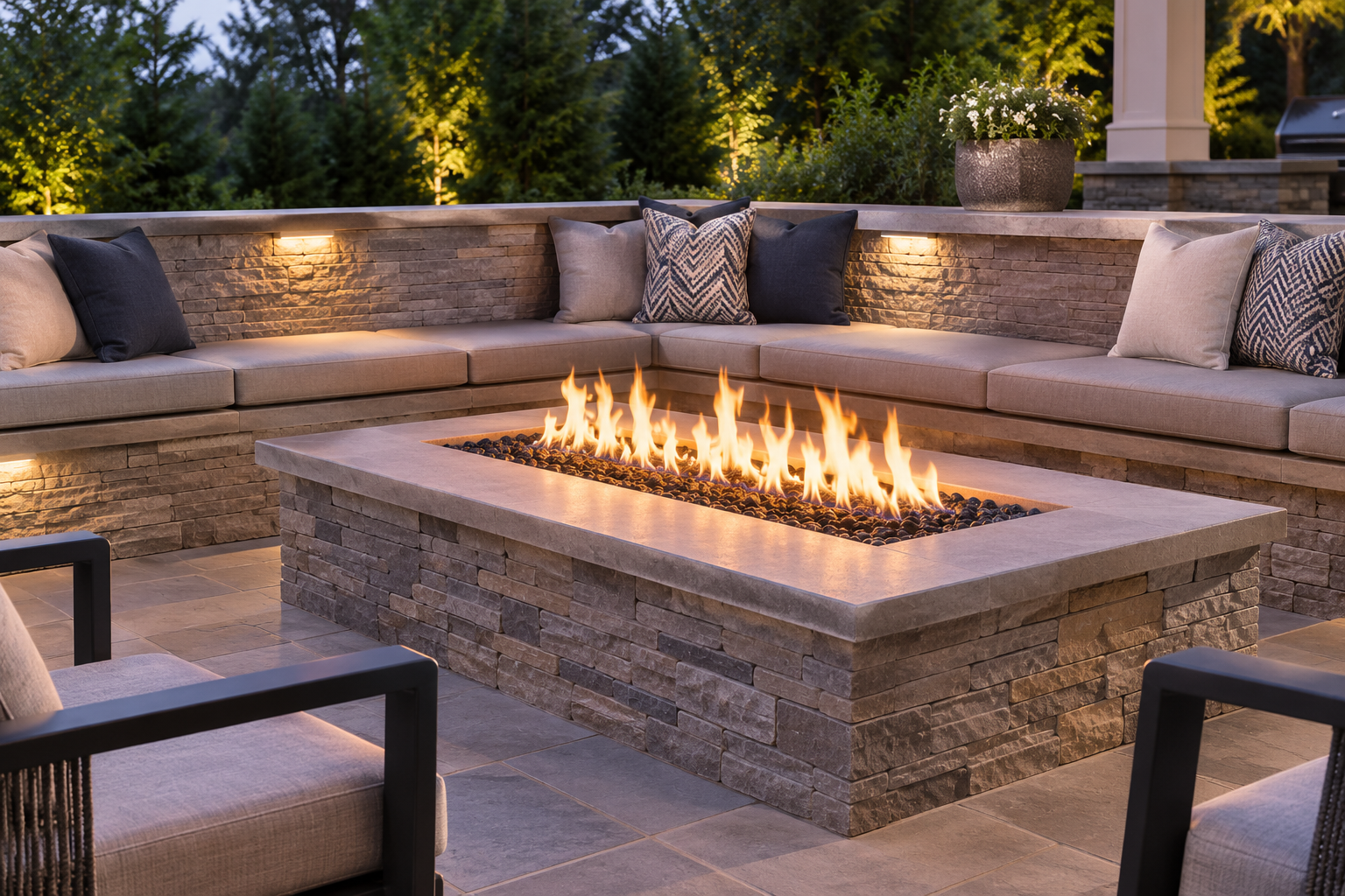 Modern gas fire pit built into a stone patio